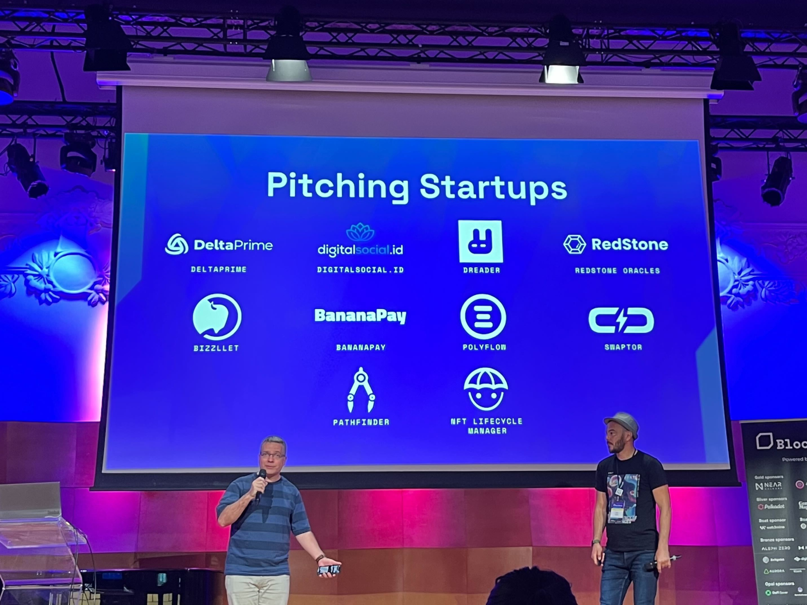 Pitching Bizzllet on stage at a Web3 startup showcase.