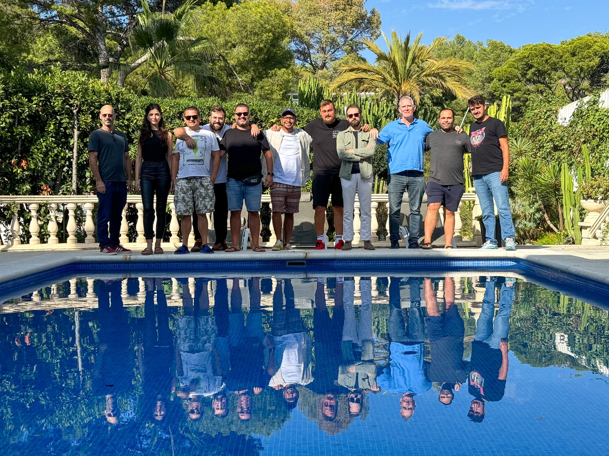 The full team photographed together by the poolside during the 10-day workshop in Spain.