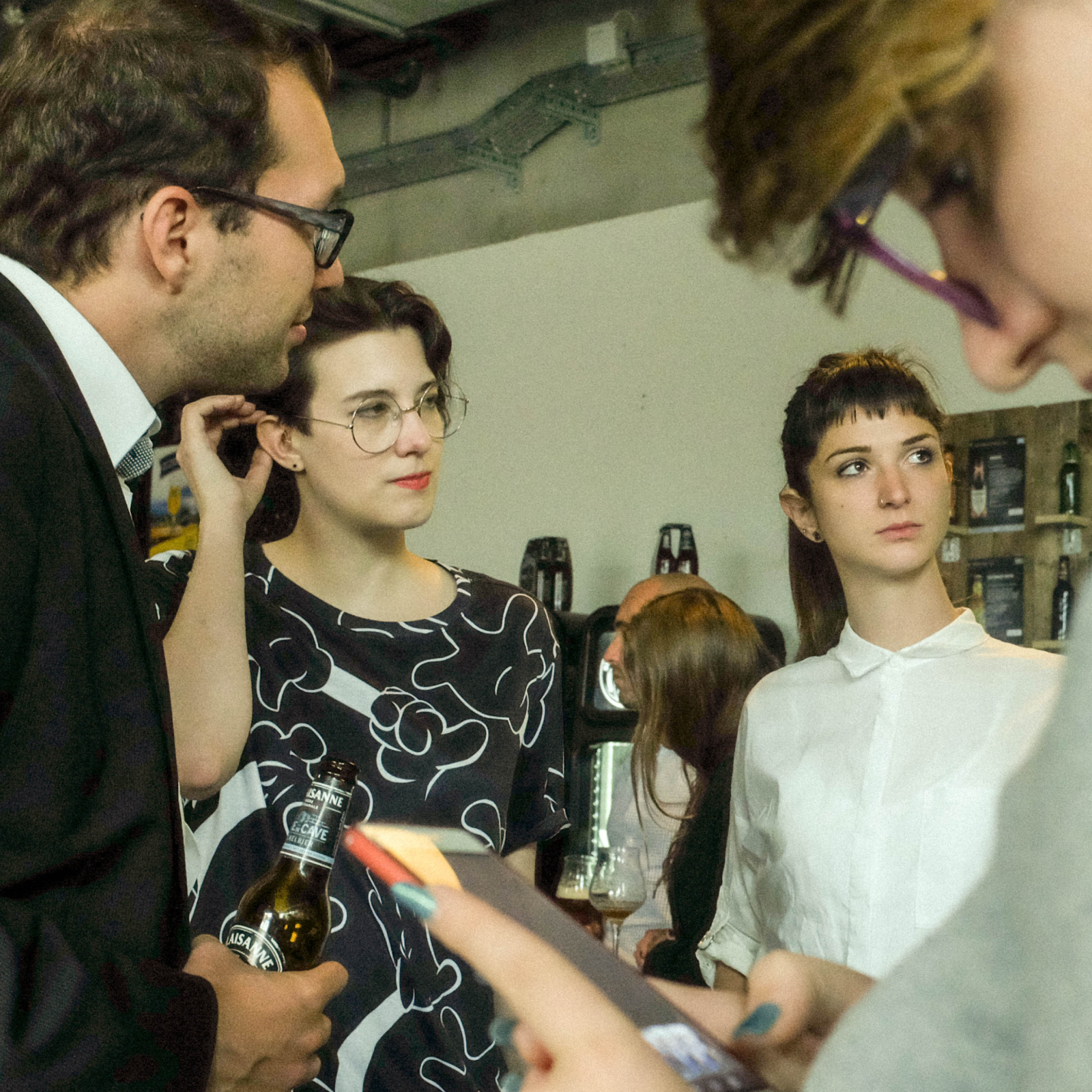 Team in conversation at a design event.