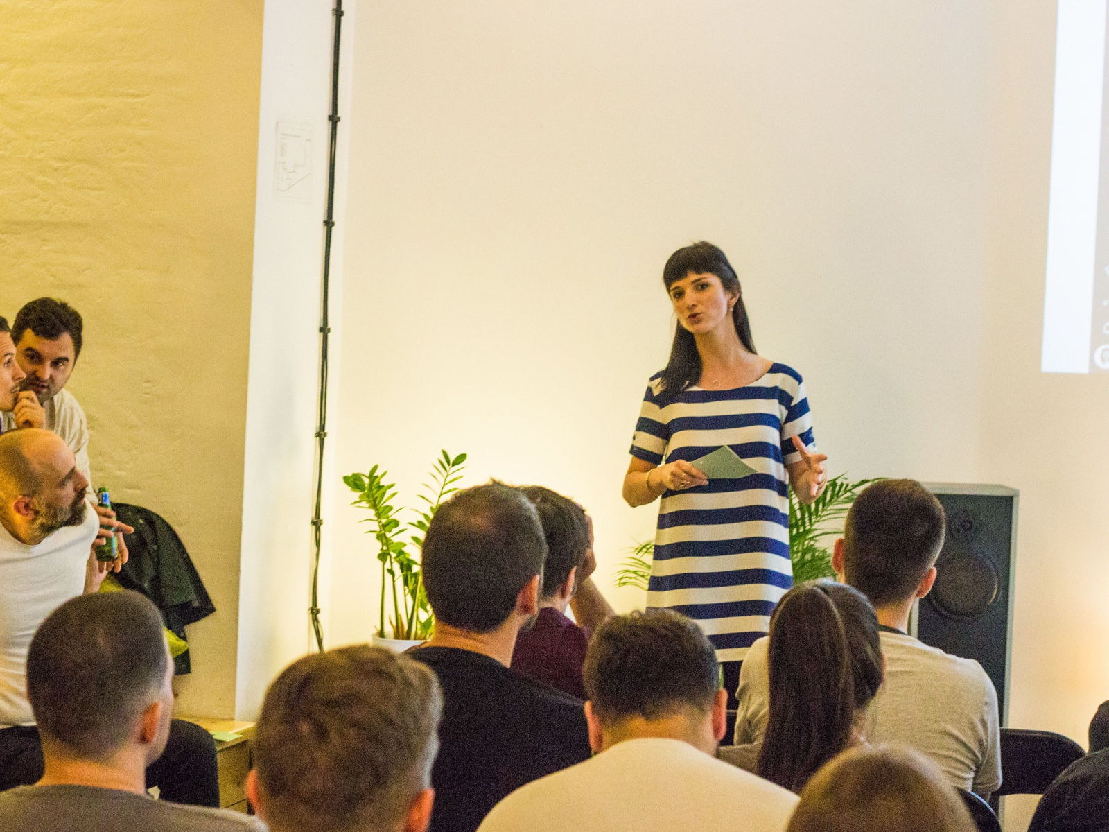 Marija speaking to the audience at an IxDA design community event.